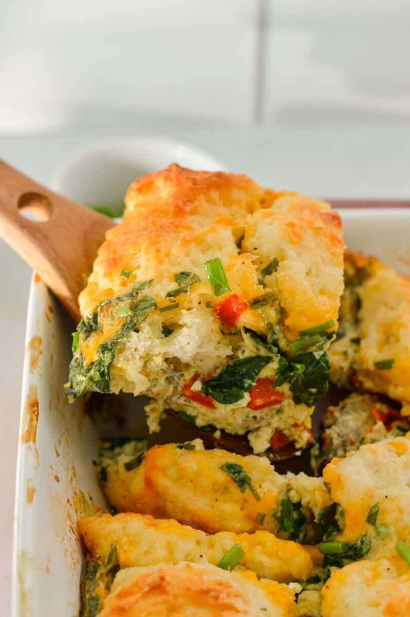 Serving a slice of biscuit breakfast bake.