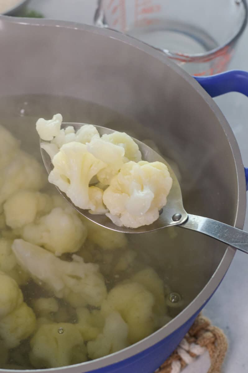 Boiling cauliflower florets.