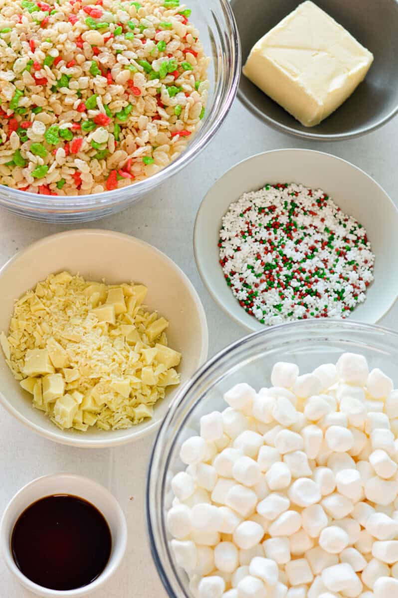 Ingredients including marshmallows, rice krispies, sprinkles, white chocolate, butter and salt.