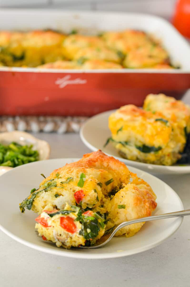 Serving plates of biscuit breakfast bake.