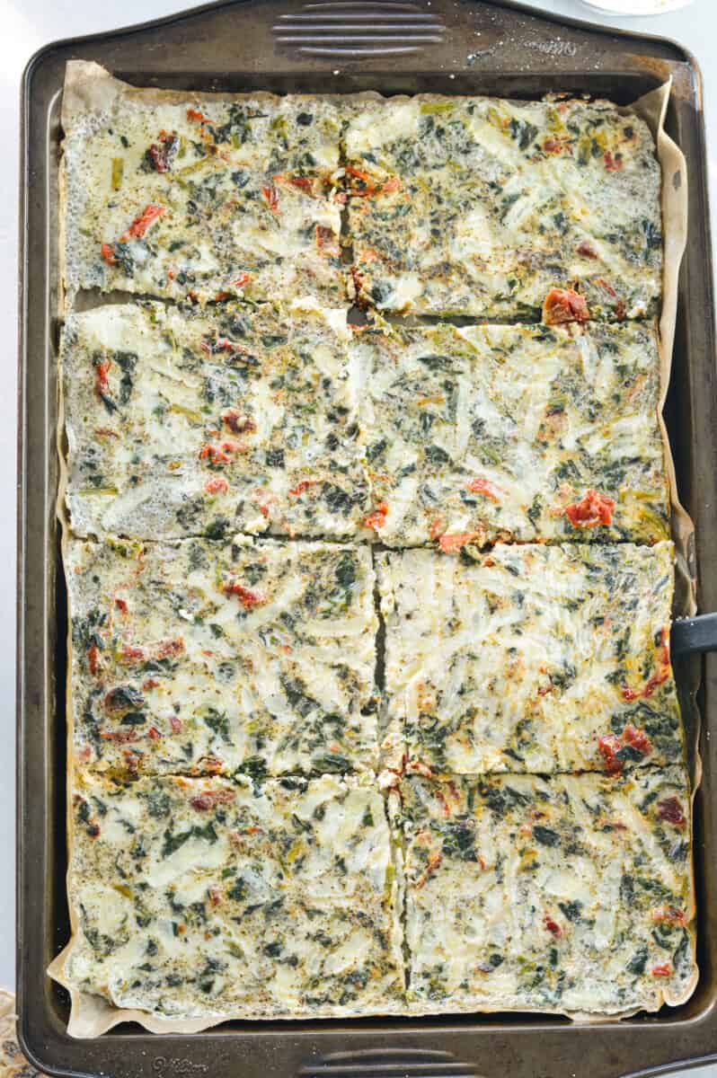 Slicing egg white bake into sheet slices.