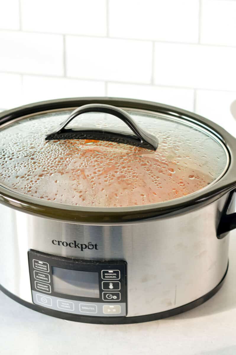 Cooking slow cooker stuffed pepper soup.