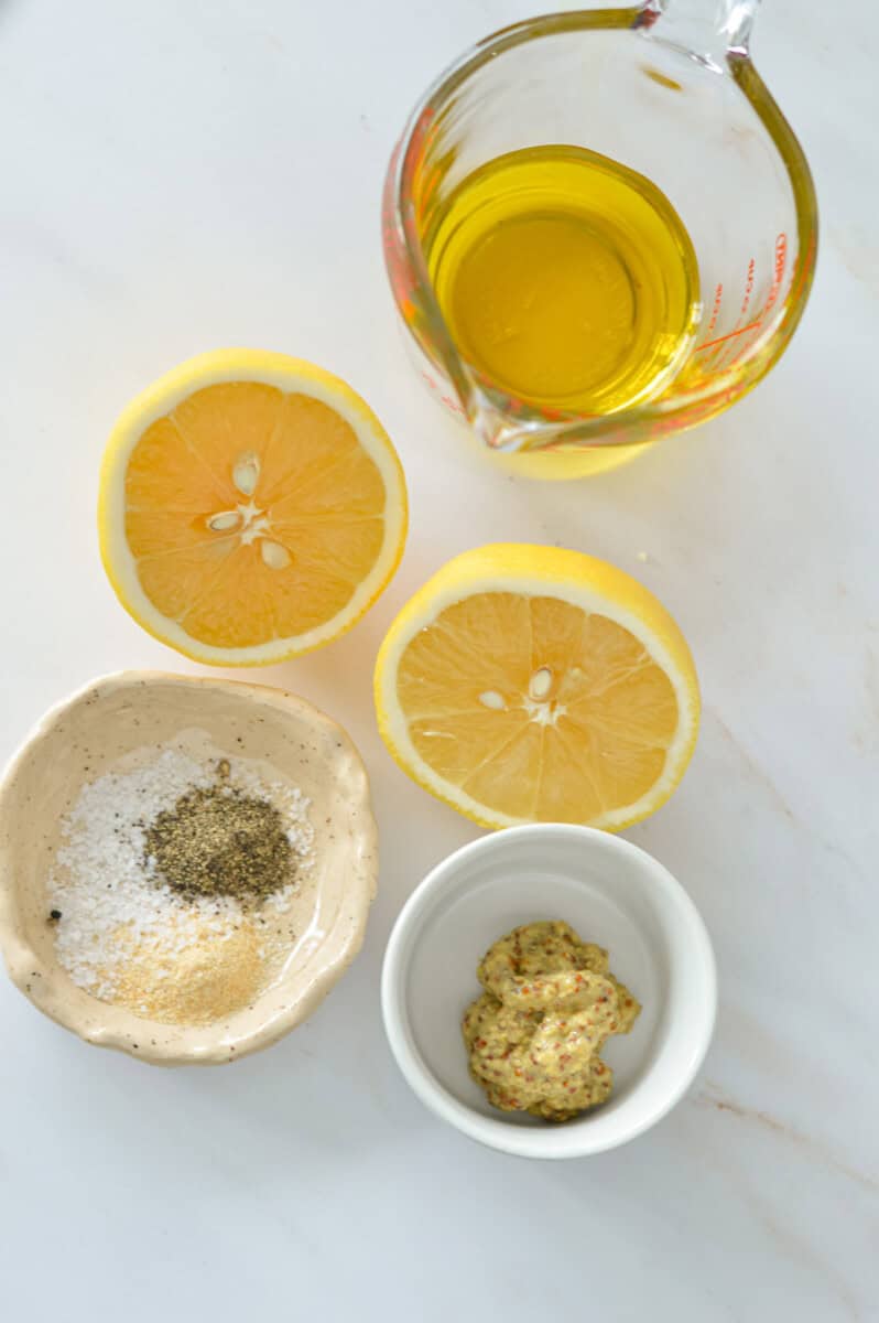 Ingredients including olive oil, lemon, salt, seasoning and dijon mustard.