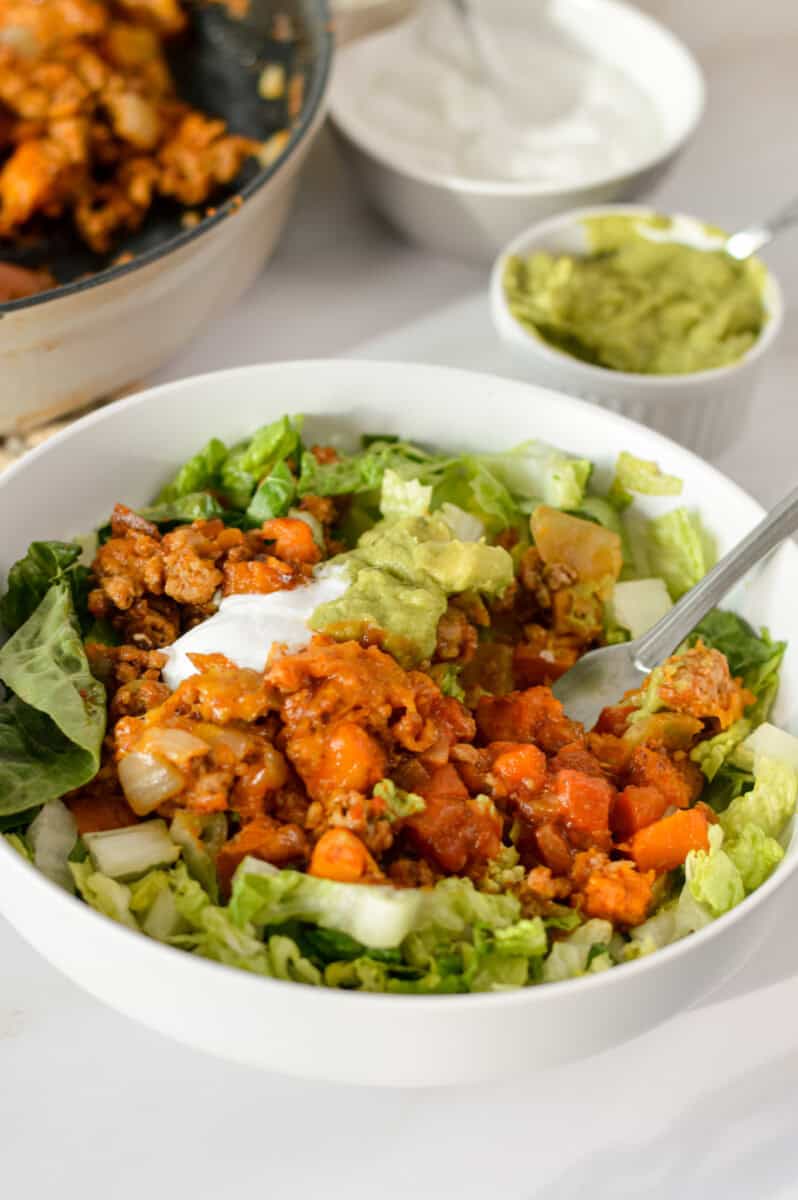 Turkey sweet potato taco bowls served on lettuce.