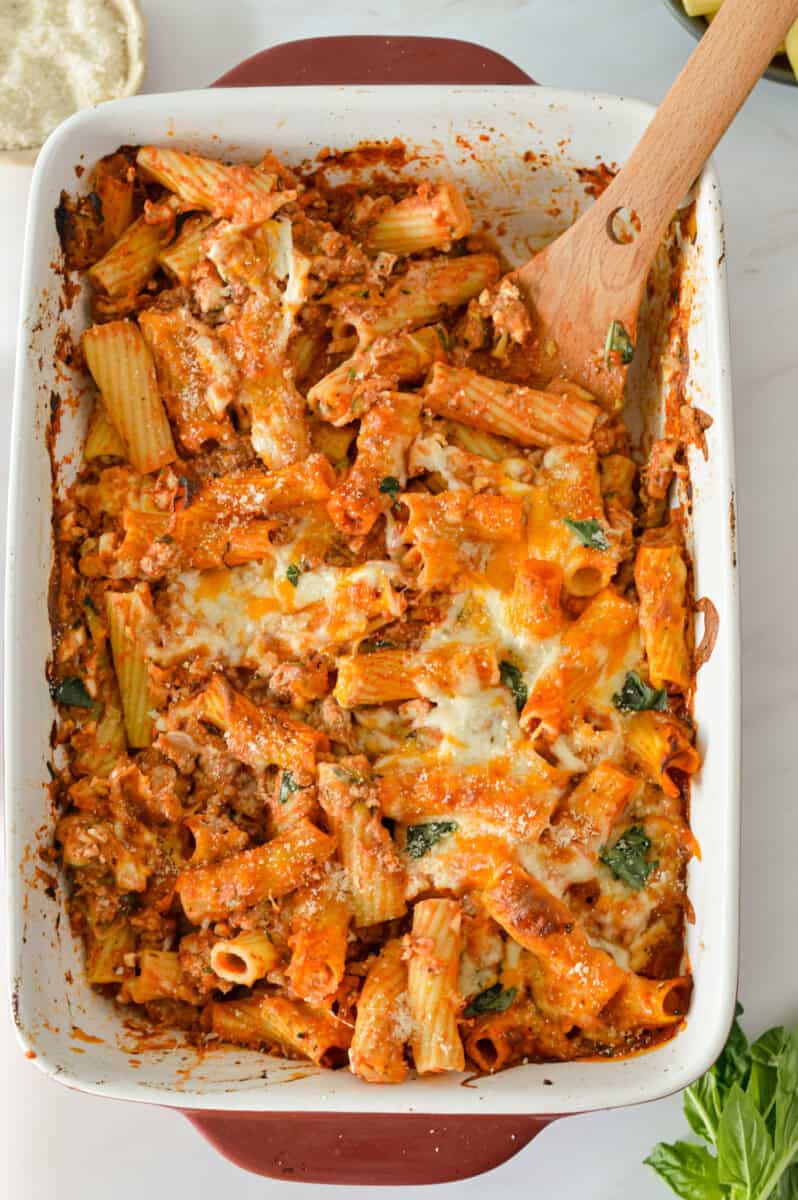Baked sausage pasta in a casserole dish.