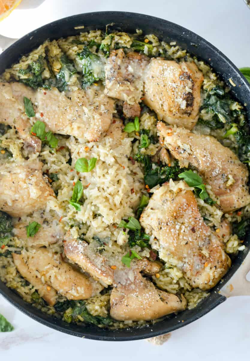 Birds eye of a one pan chicken thighs and pesto rice.