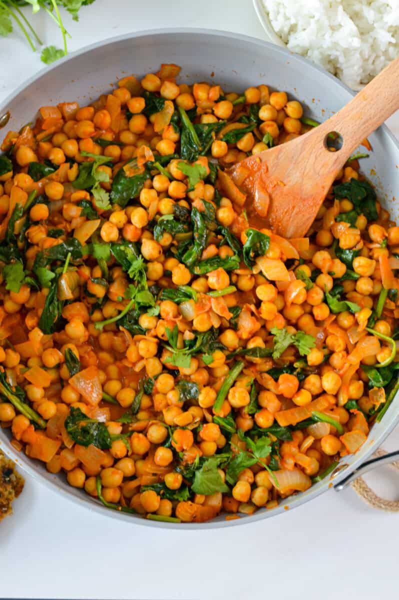 Birds eye of a pot with chickpea and spinach curry.
