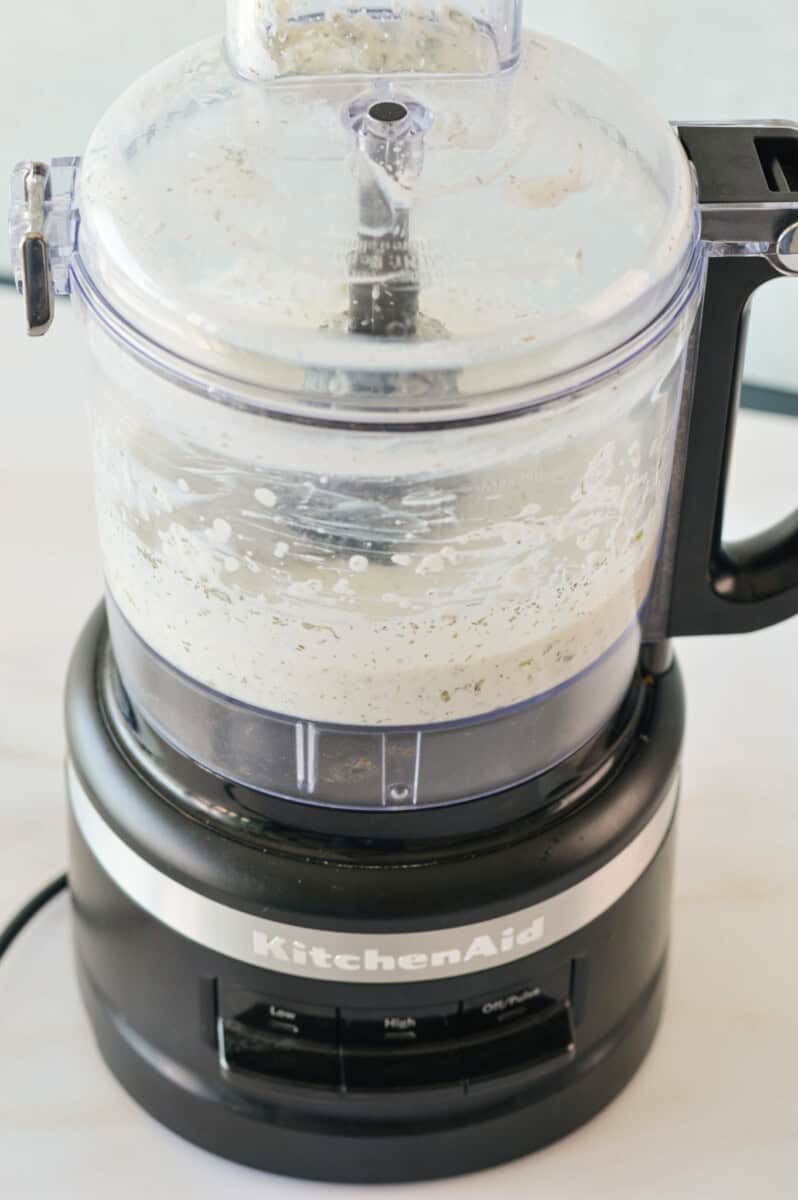 Blending ranch dip in a food processor. 