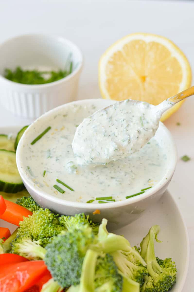 Spooning cottage cheese ranch dip.