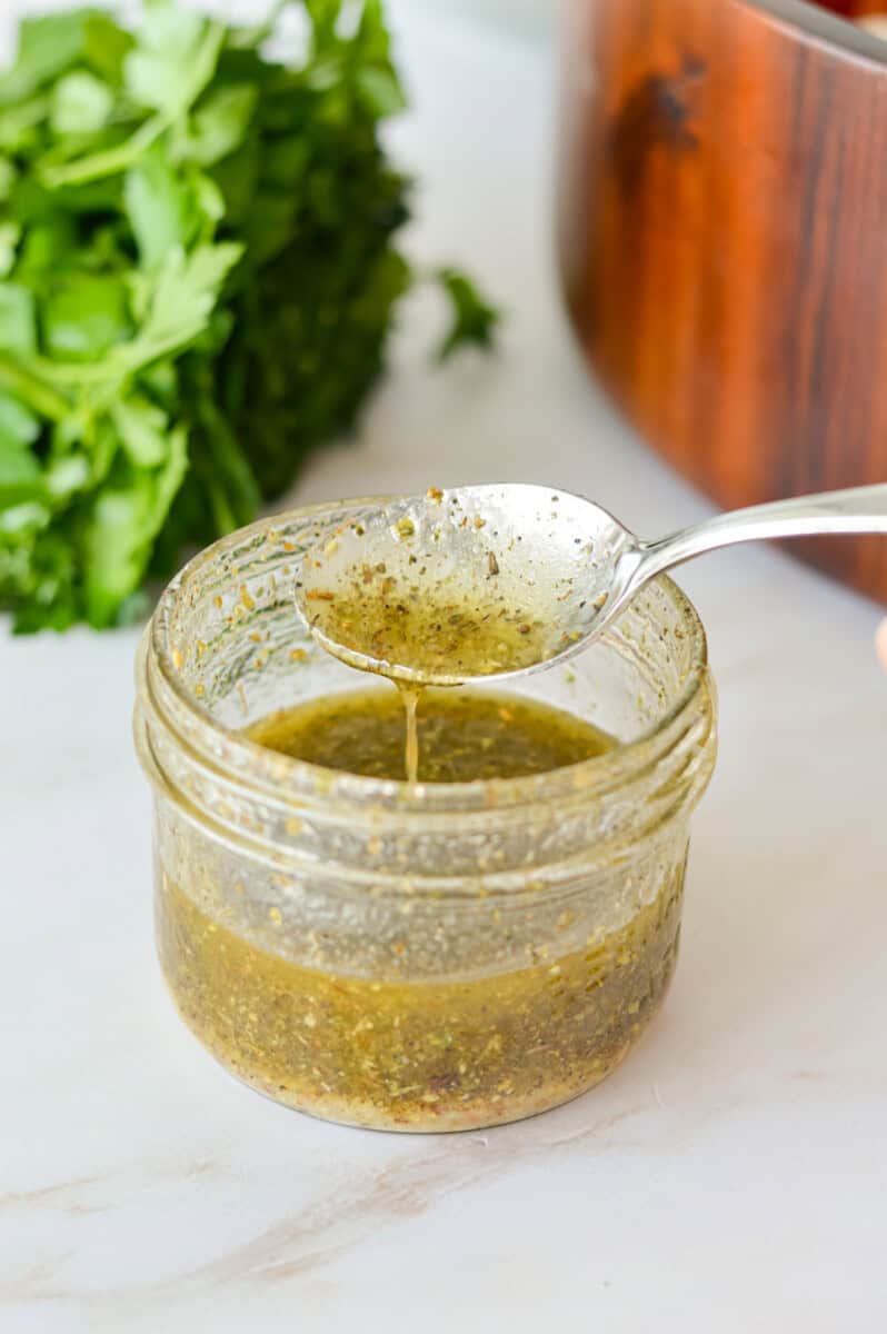 Jar of dense bean salad dressing.