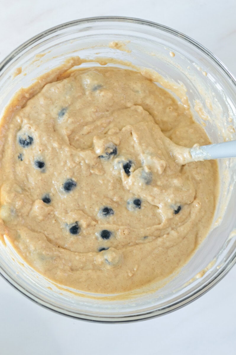 Mixing blueberry muffin batter.