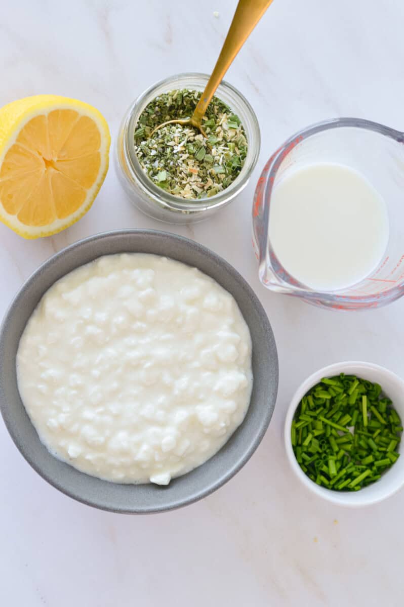 Ingredients including cottage cheese, herbs, lemon juice, milk and ranch seasoning.