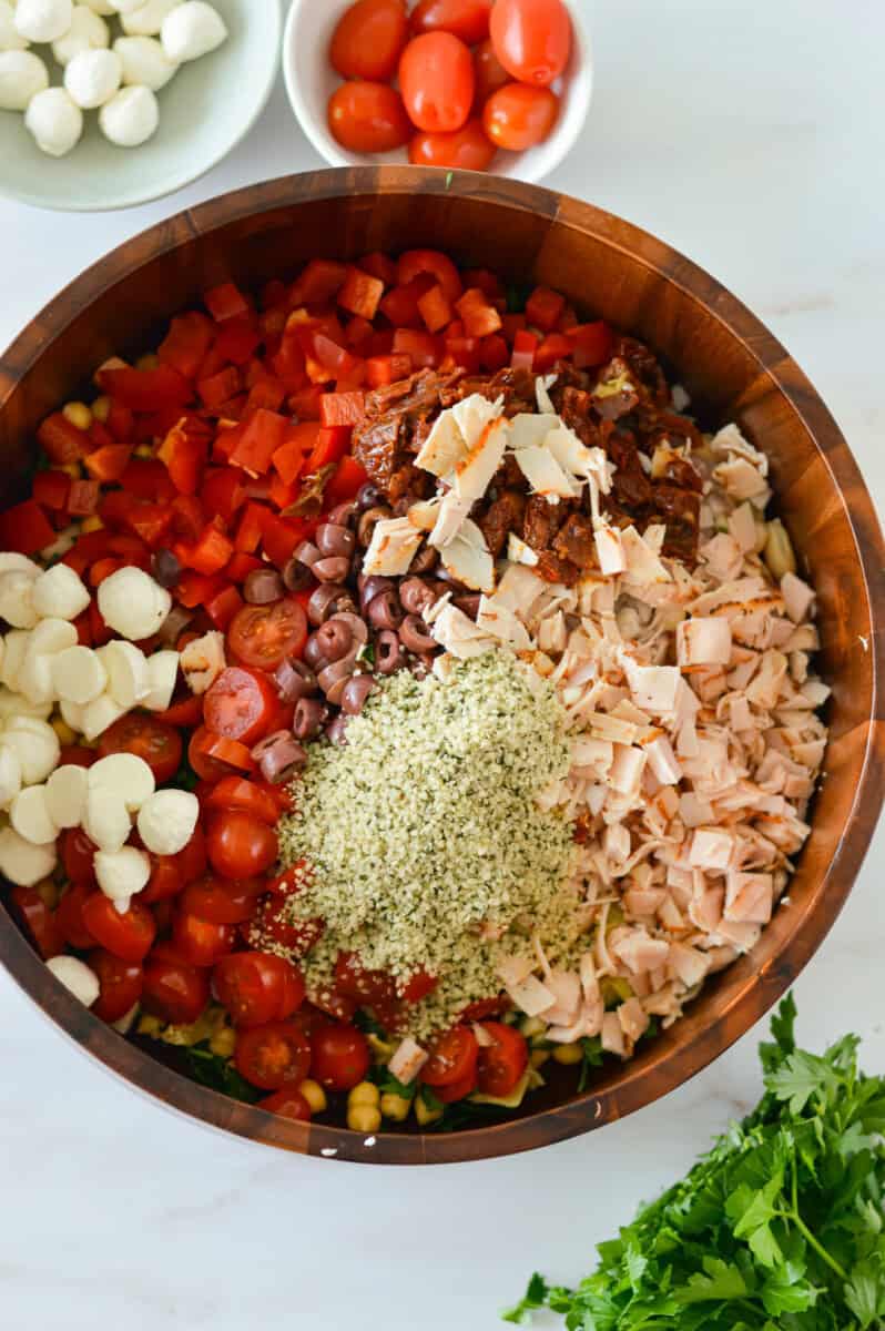 Birds eye of bowl with unmixed bean salad ingredients.