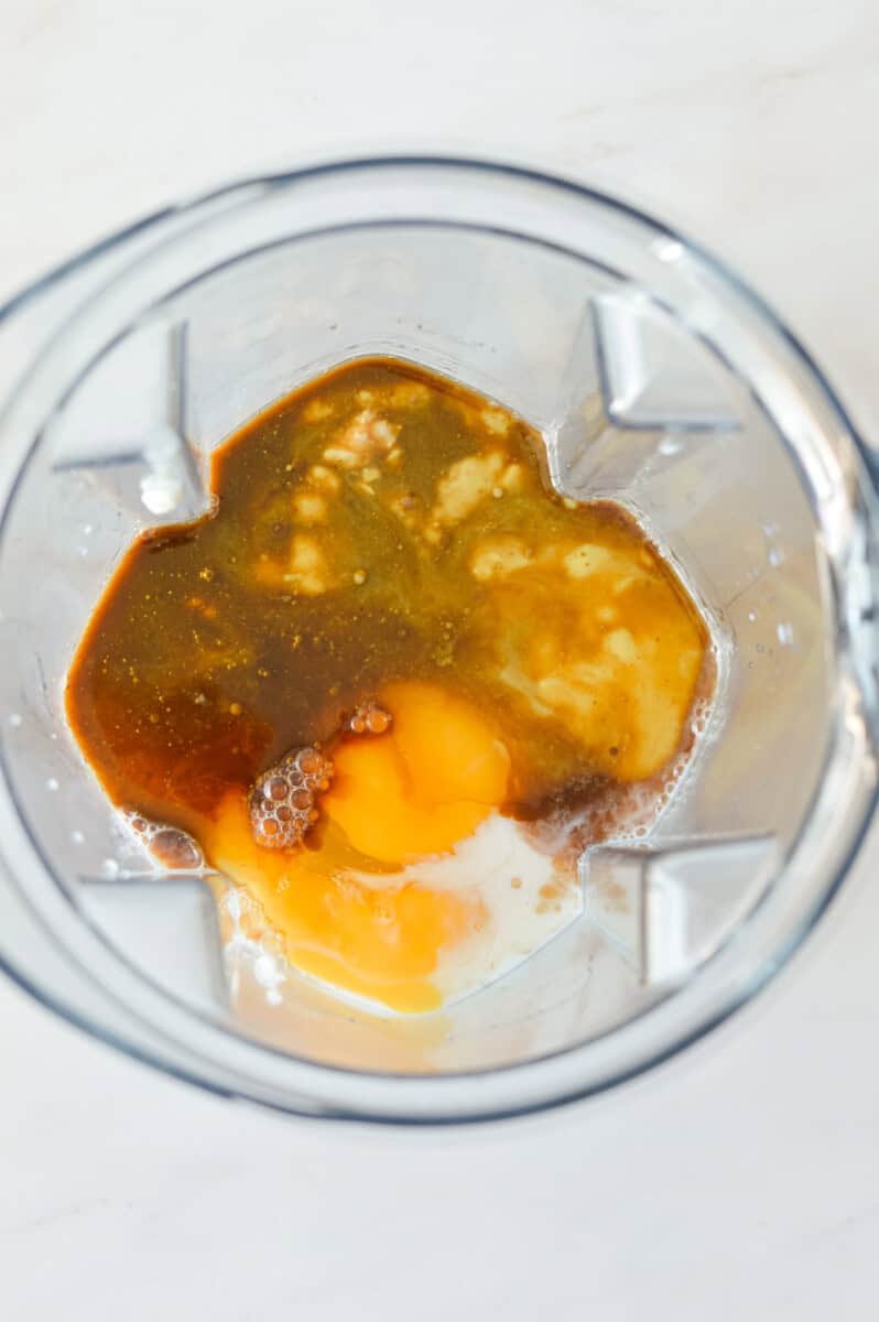 Blending wet ingredients in a blender.