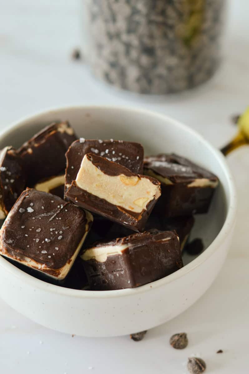 Bowl of chocolate covered frozen yogurt bites.