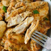 Bowl of sliced greek chicken thighs.