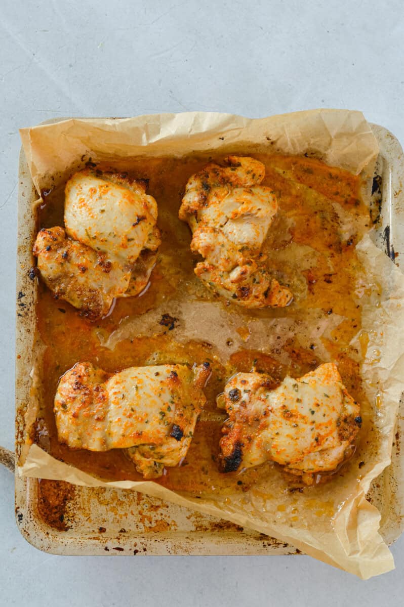 Tray of cooked air fryer chicken thighs.