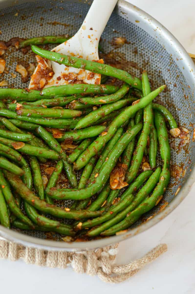 Close up of pan fried green beans.