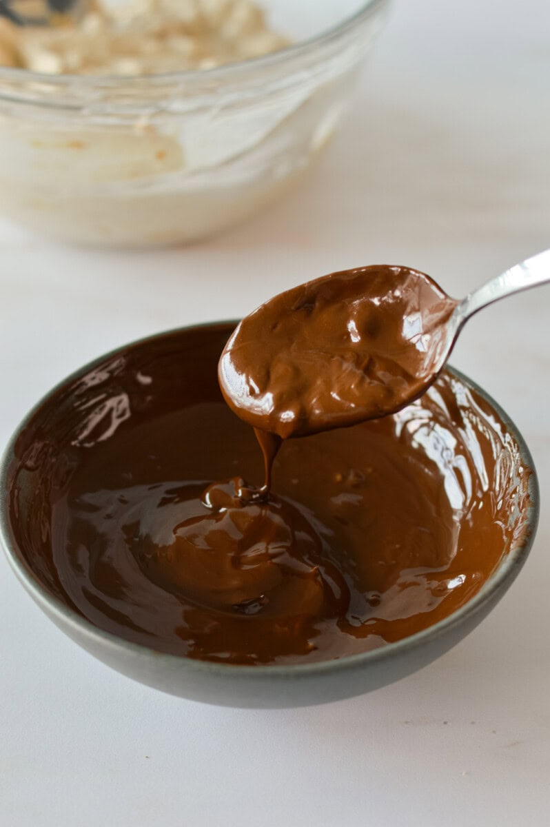 Mixing a bowl of melted chocolate.