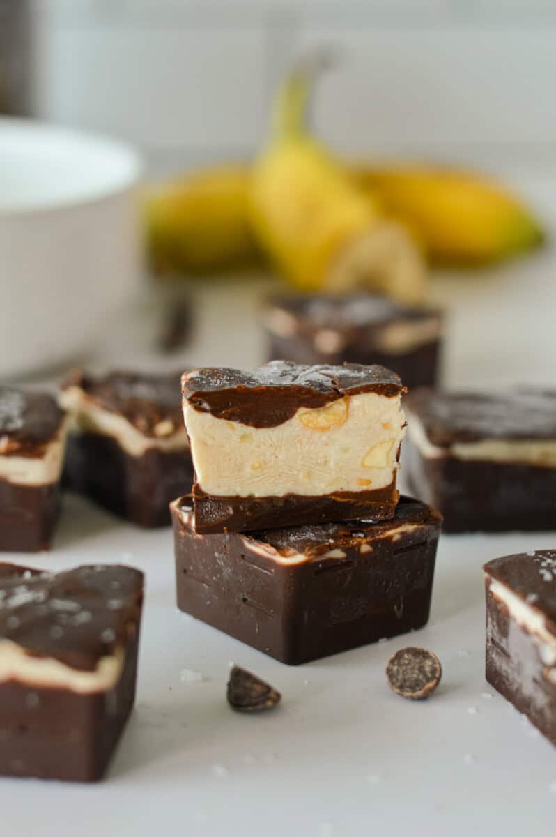 Two stacked pieces of frozen yogurt banana bites.