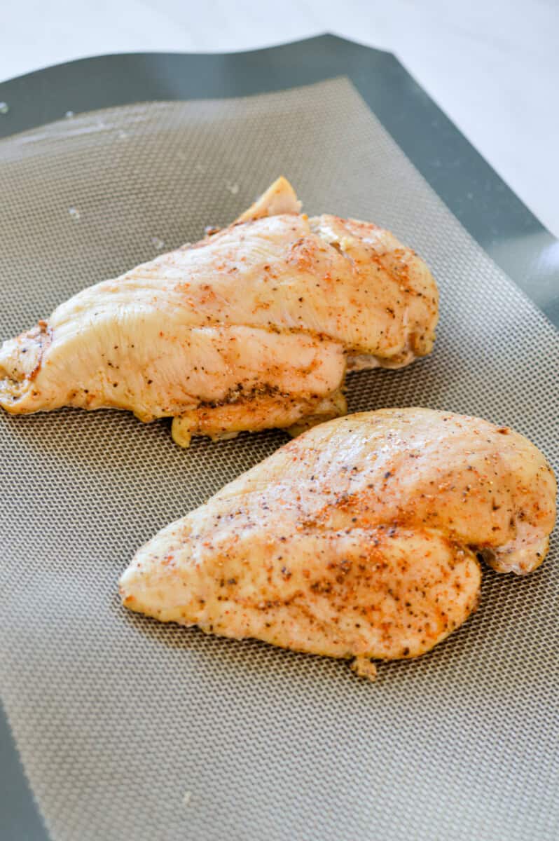 Baking two chicken breasts.
