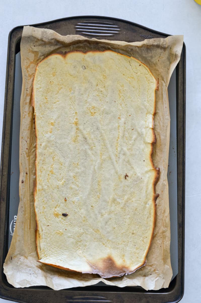 Baked cottage cheese wraps in a tray.