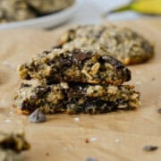 A banana oatmeal chocolate chip cookie split in half and stacked.