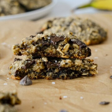 A banana oatmeal chocolate chip cookie split in half and stacked.