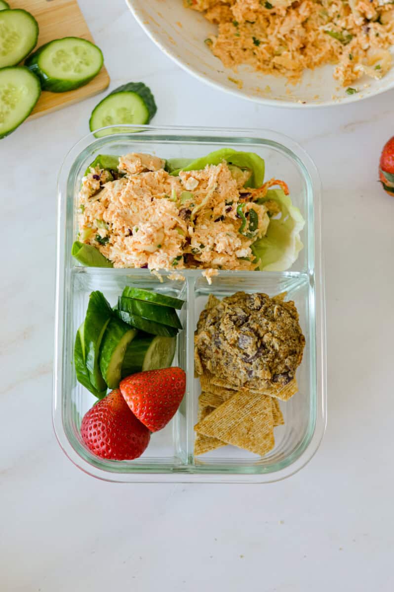 Birds eye of adult lunchable with bfufalo chicken salad, veggies and crackers.