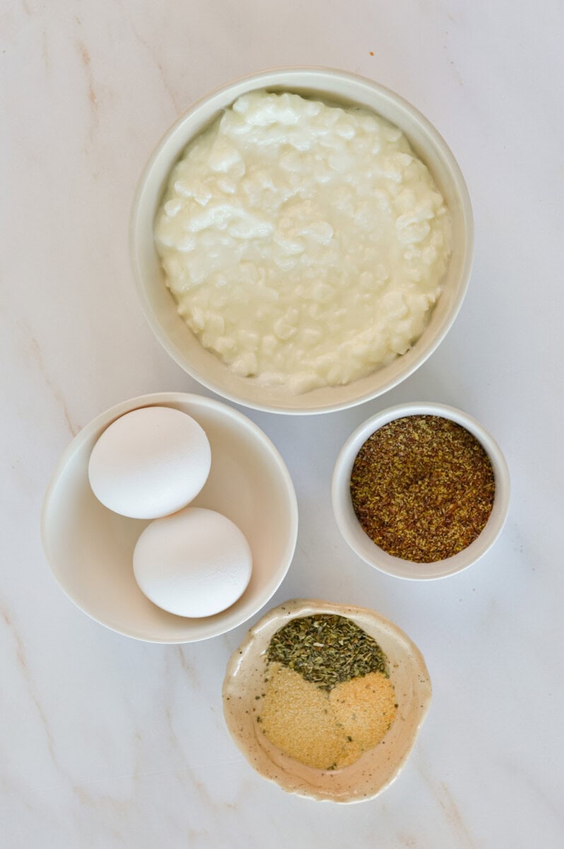 Ingredients including eggs, flaxseed, spices and cottage cheese.