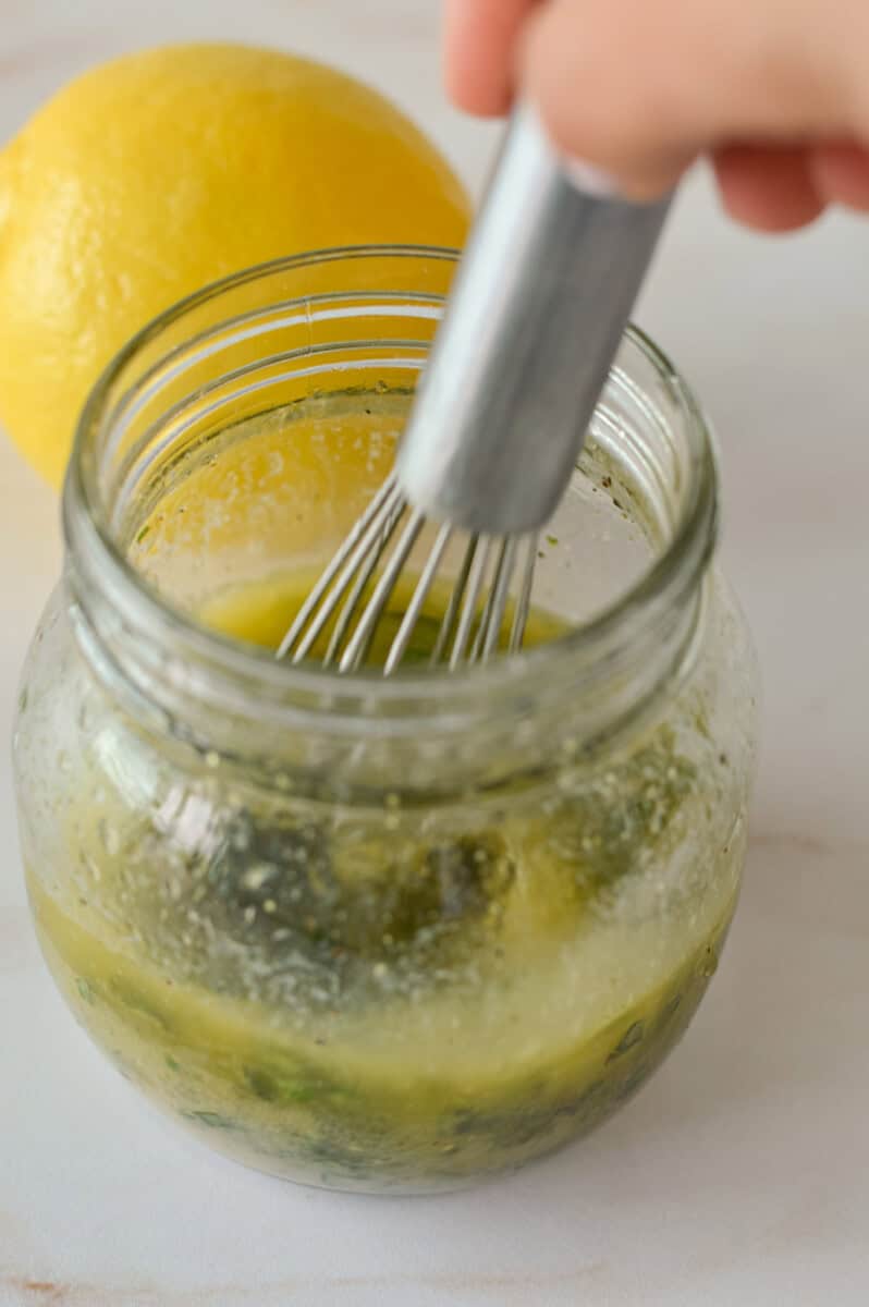 Whisking together a lemon basil garlic butter.