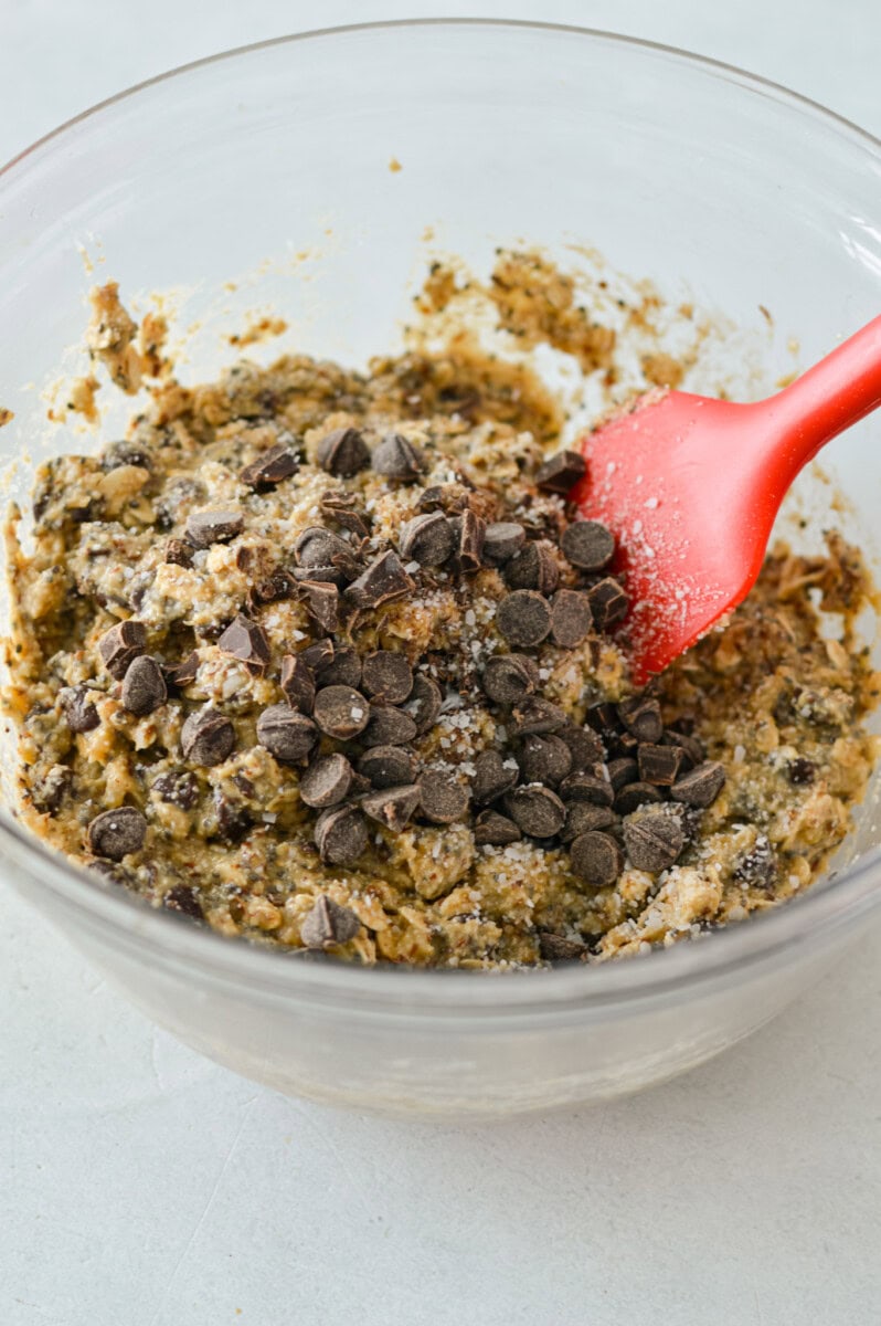 Folding chocolate chips into banana oatmeal cookie dough.
