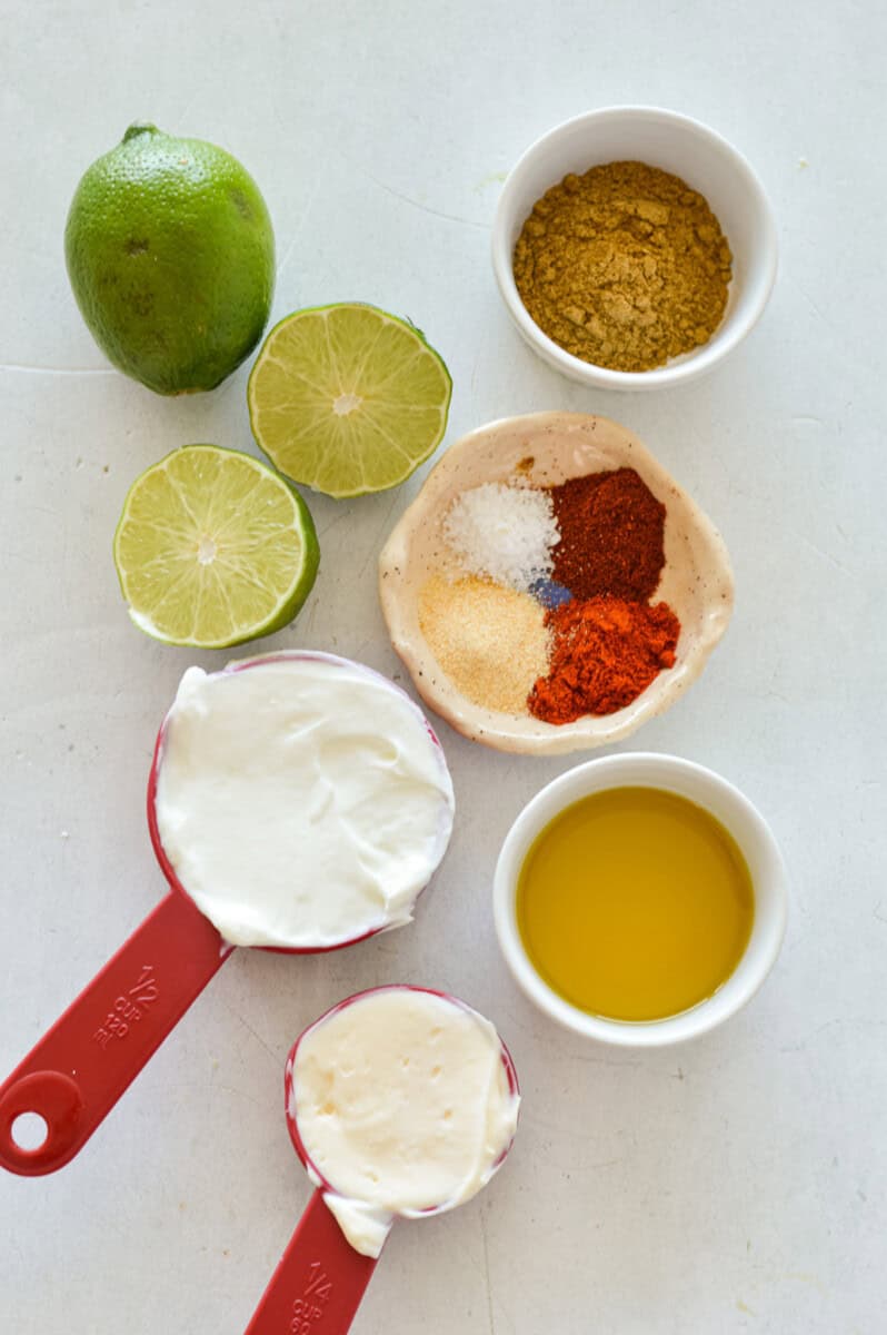 Ingredients including mayonnaise, greek yogurt, lime juice, olive oil and spices.