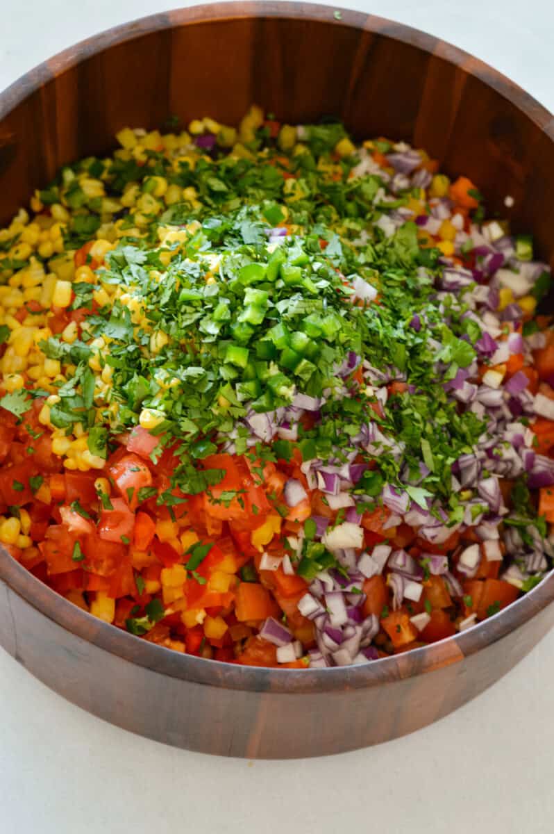 Bowl of unmixed pearl couscous salad.
