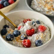 Bowl of chia pudding topped with berries.