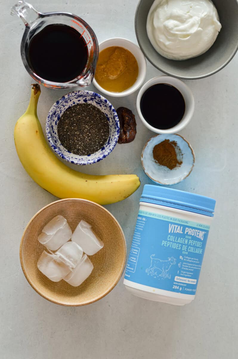 Ingredients including cold brew, collagen, banana, ice, chia seed, peanut butter, milk, greek yogurt, dates and vanilla.