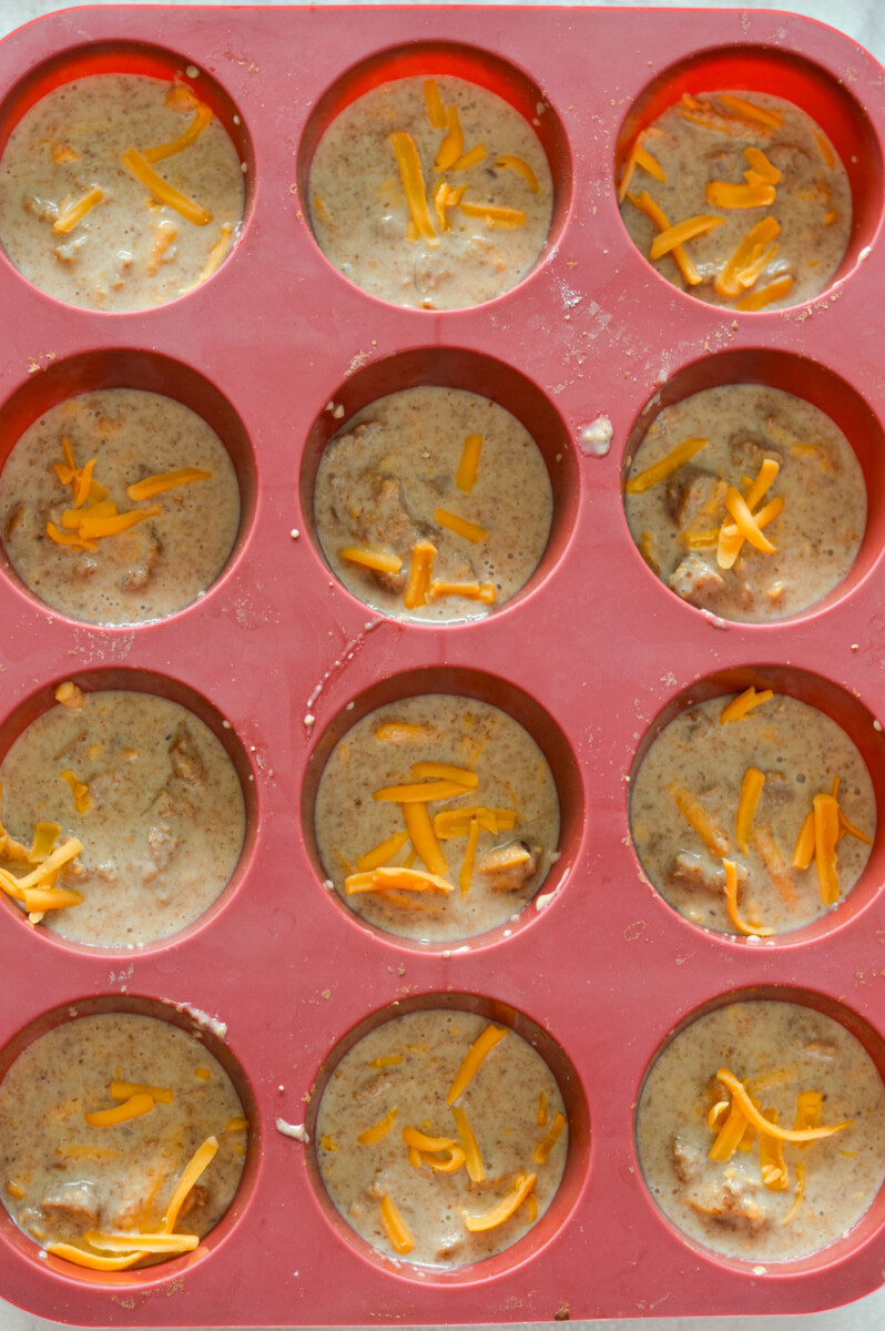 Dividing McGriddle muffin batter in muffin tray.