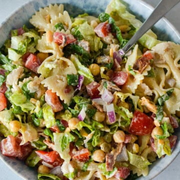 Close up of a bowl with BLT pasta salad.