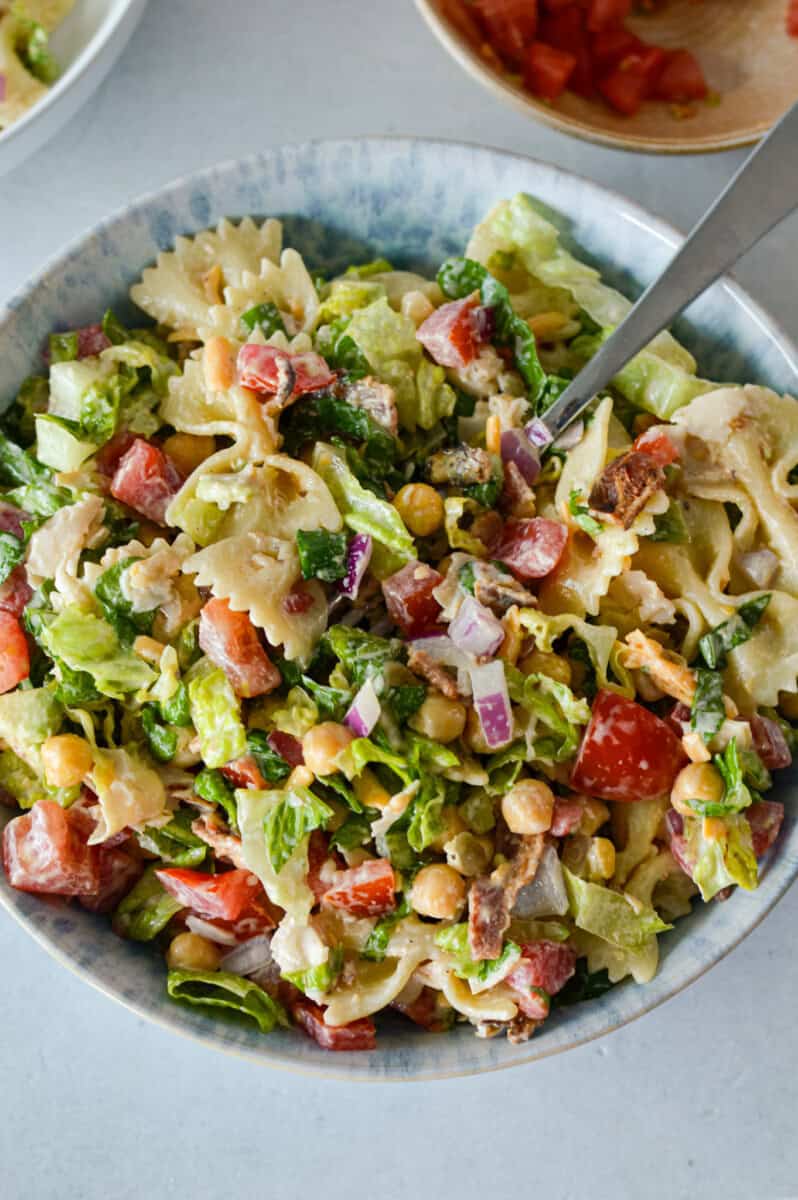 Close up of a bowl with BLT pasta salad.
