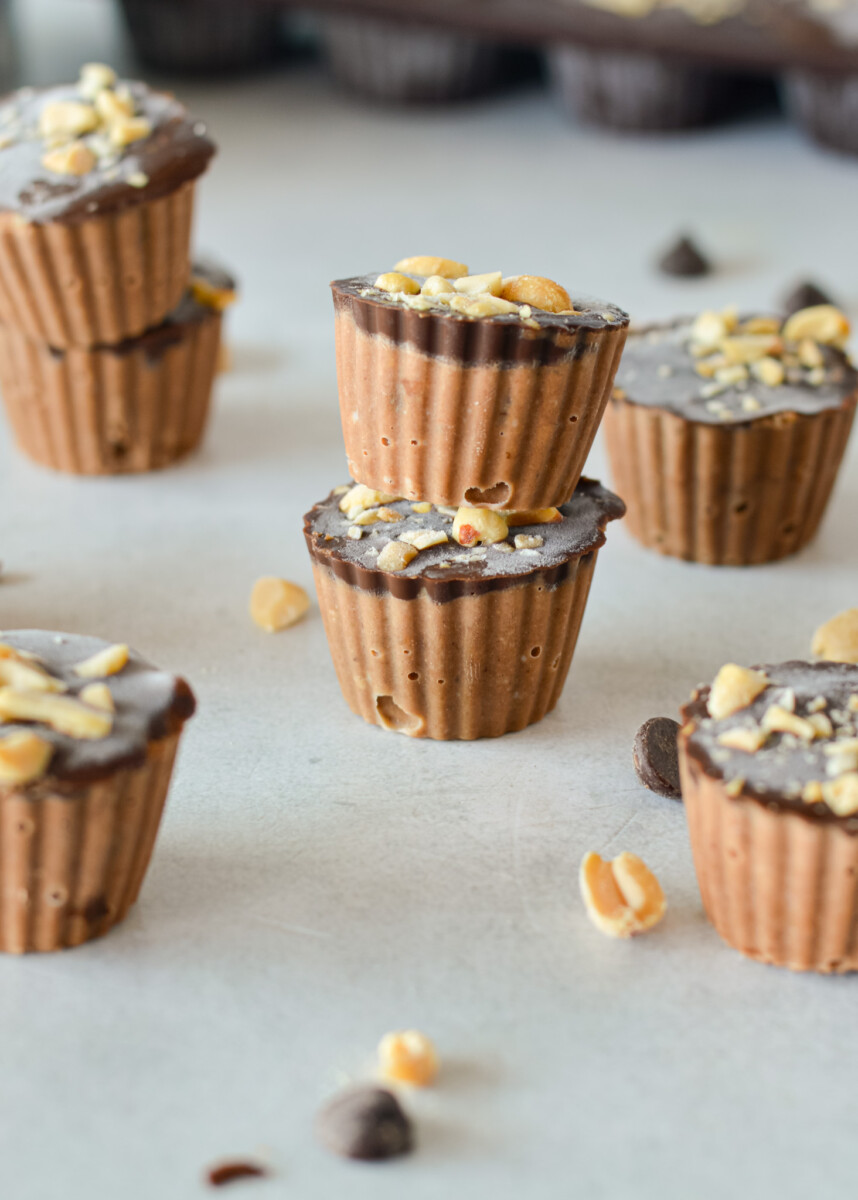 Chocolate peanut butter frozen yogurt bites stacked.