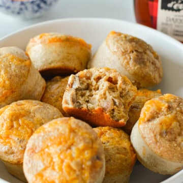 Plate of McGriddle breakfast muffins, with a bite out of one.