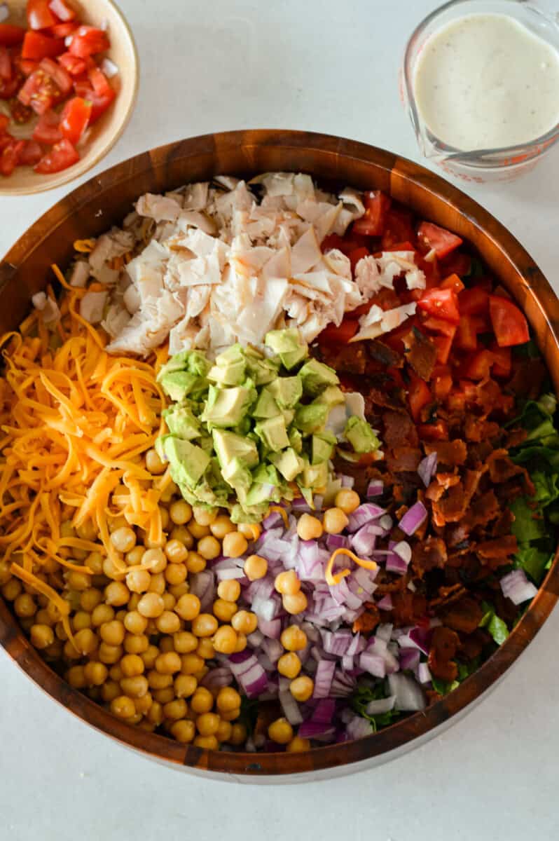 Unmixed BLT pasta salad in a bowl.