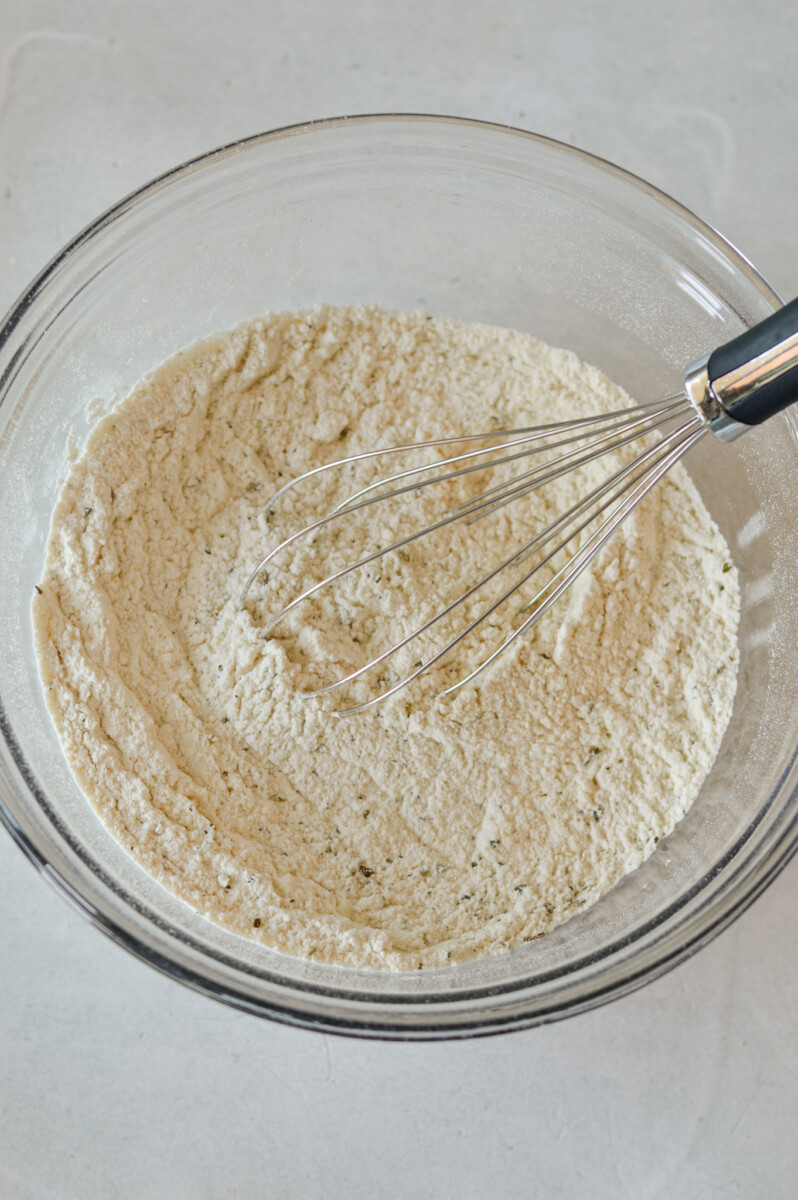 Whisking flour and spices.