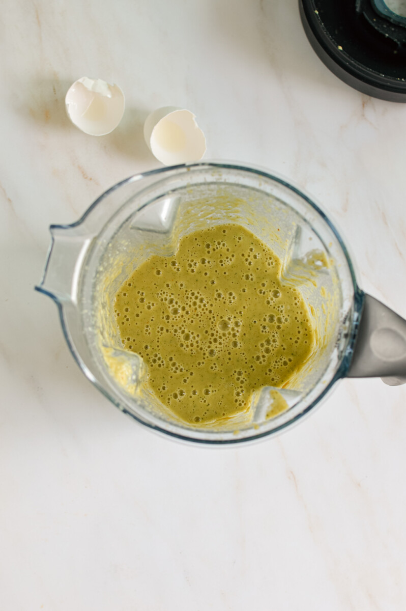 Birds eye of blender with wet ingredients.