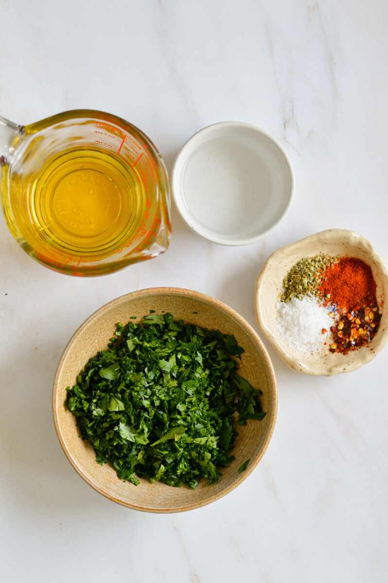 Ingredients including parsley, olive oil, lemon and spices.