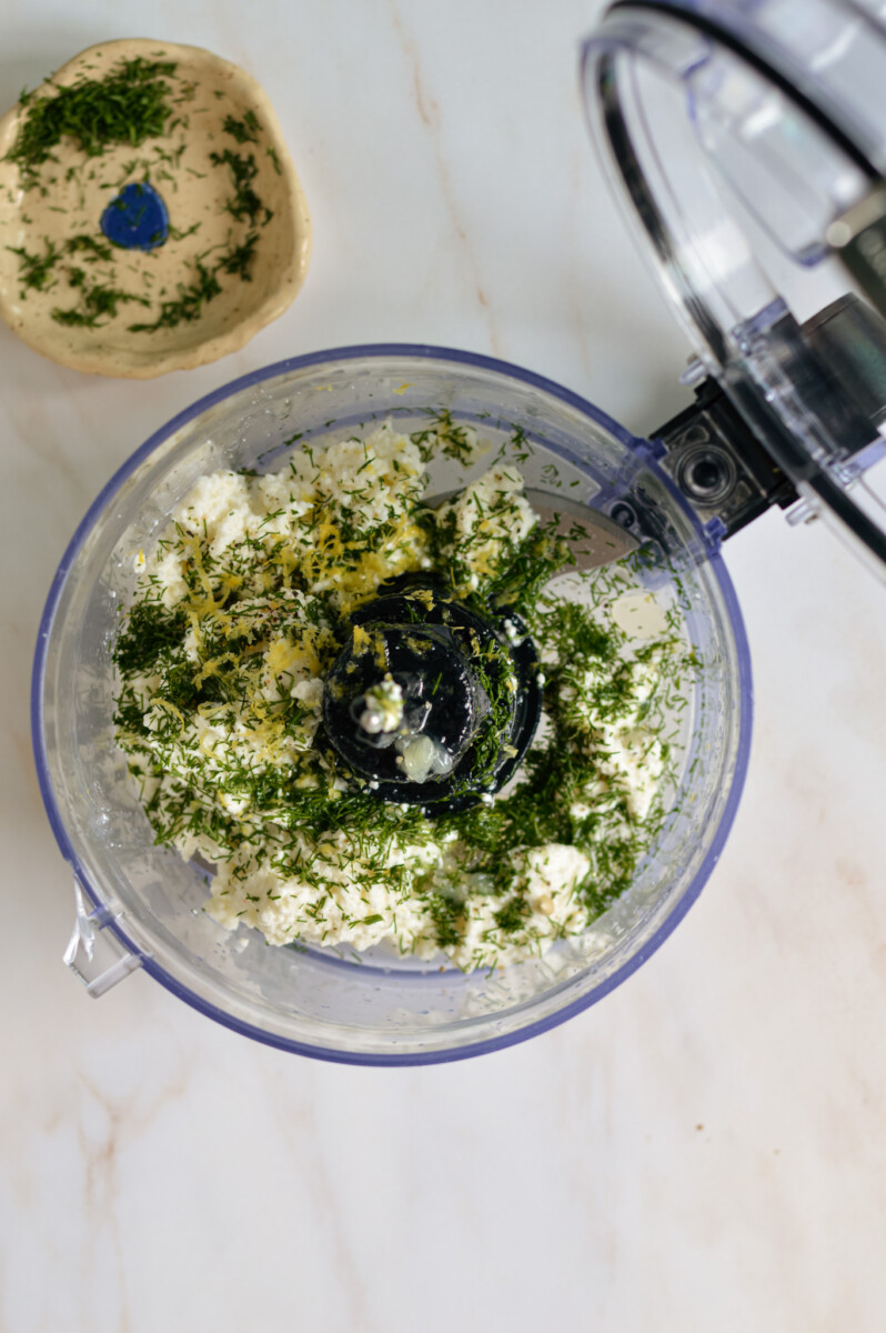 Ricotta, lemon juice, fresh herbs and olive oil in a food processor.