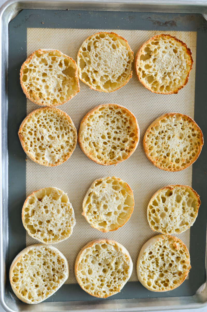 Toasting english muffins on a pan.