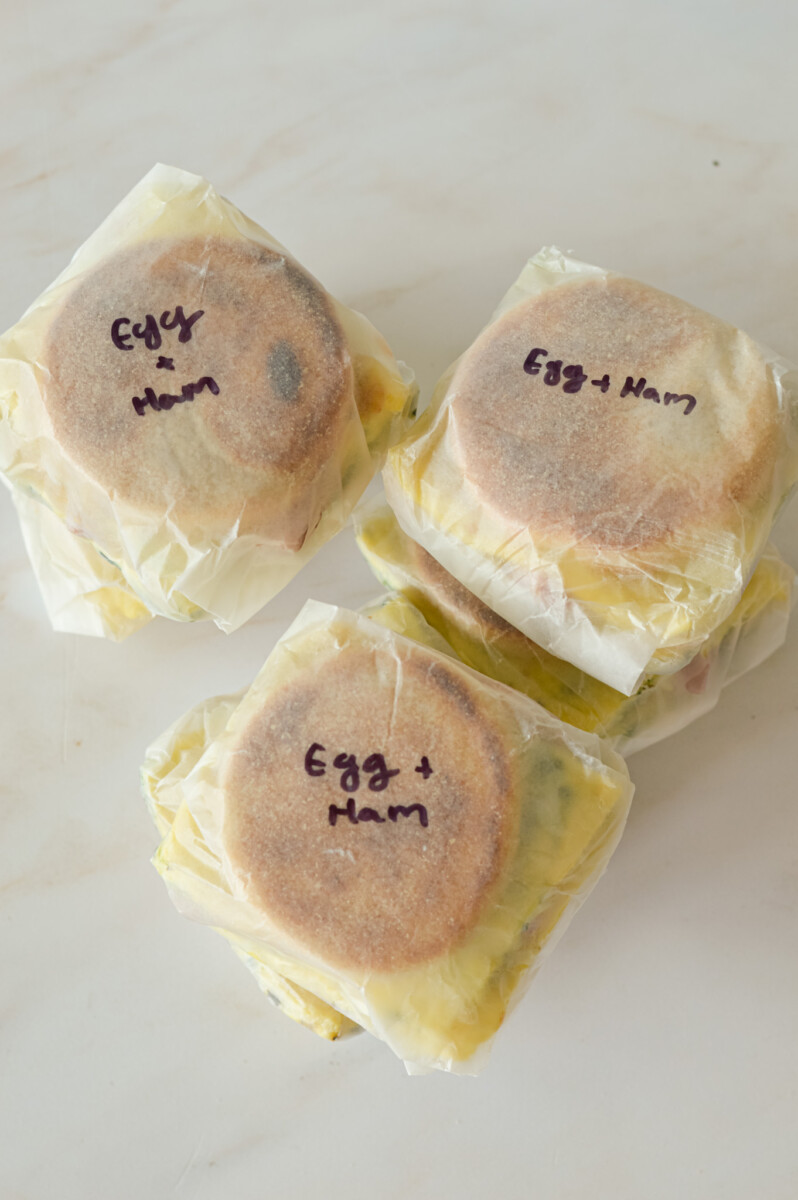 Wrapping freezer breakfast sandwiches.